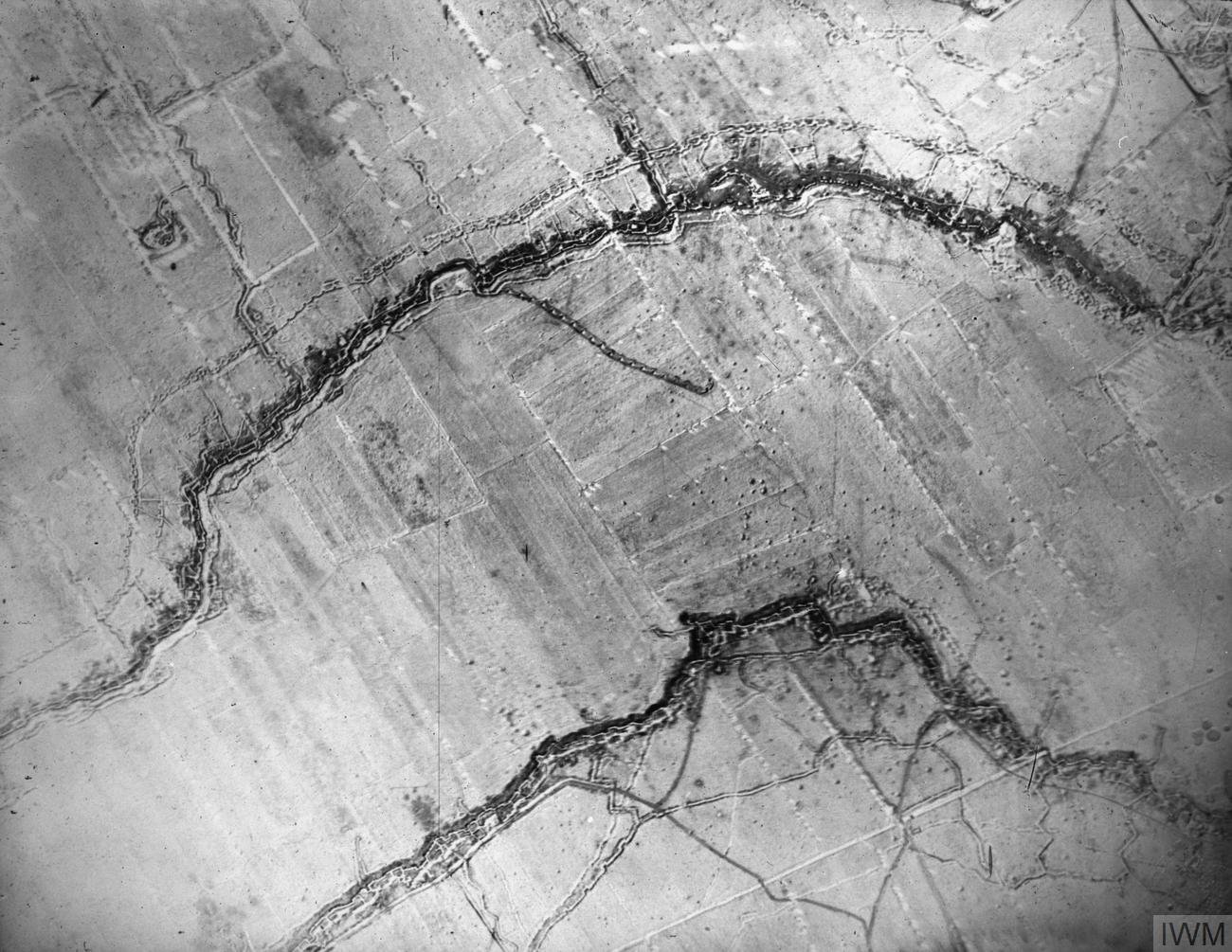 Aerial photograph of opposing British and German front-line trenches on the Western Front, 9 June 1916, the archetypal image of the trench warfare that shattered early-20th-century faith in inevitable progress.
